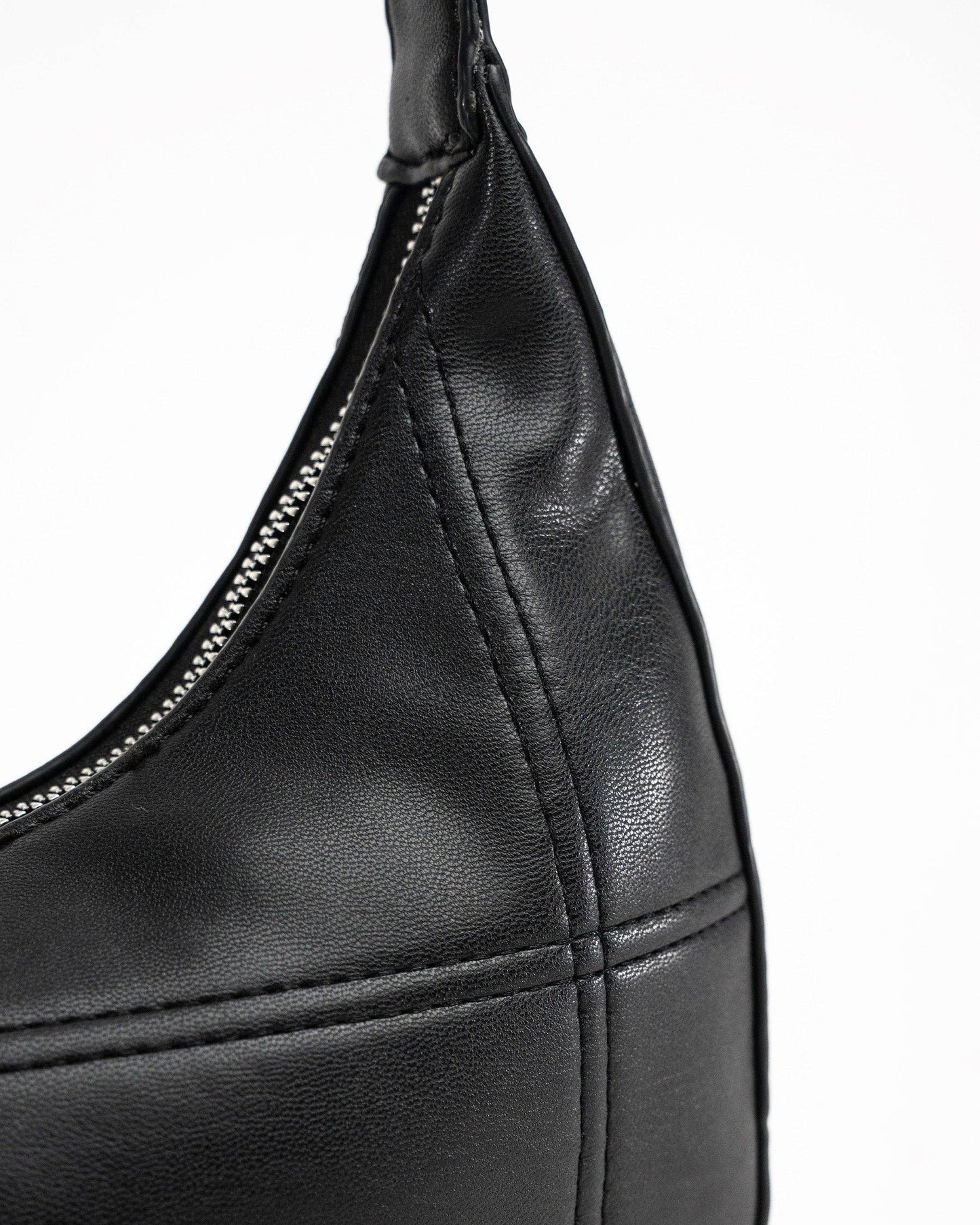 My Accessories London - Curved Quilted Leather-Look Sling Crossbody Bag in Black: Black