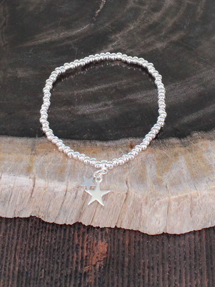 ELASTICATED BRACELET WITH STAR CHARMS [SILVER-PLATE]