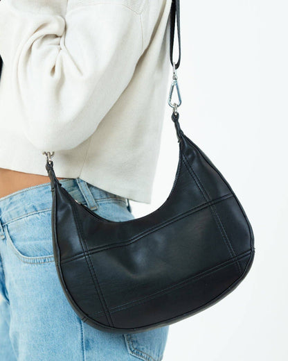 My Accessories London - Curved Quilted Leather-Look Sling Crossbody Bag in Black: Black